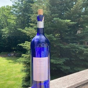 Large empty cobalt blue bottle with cork